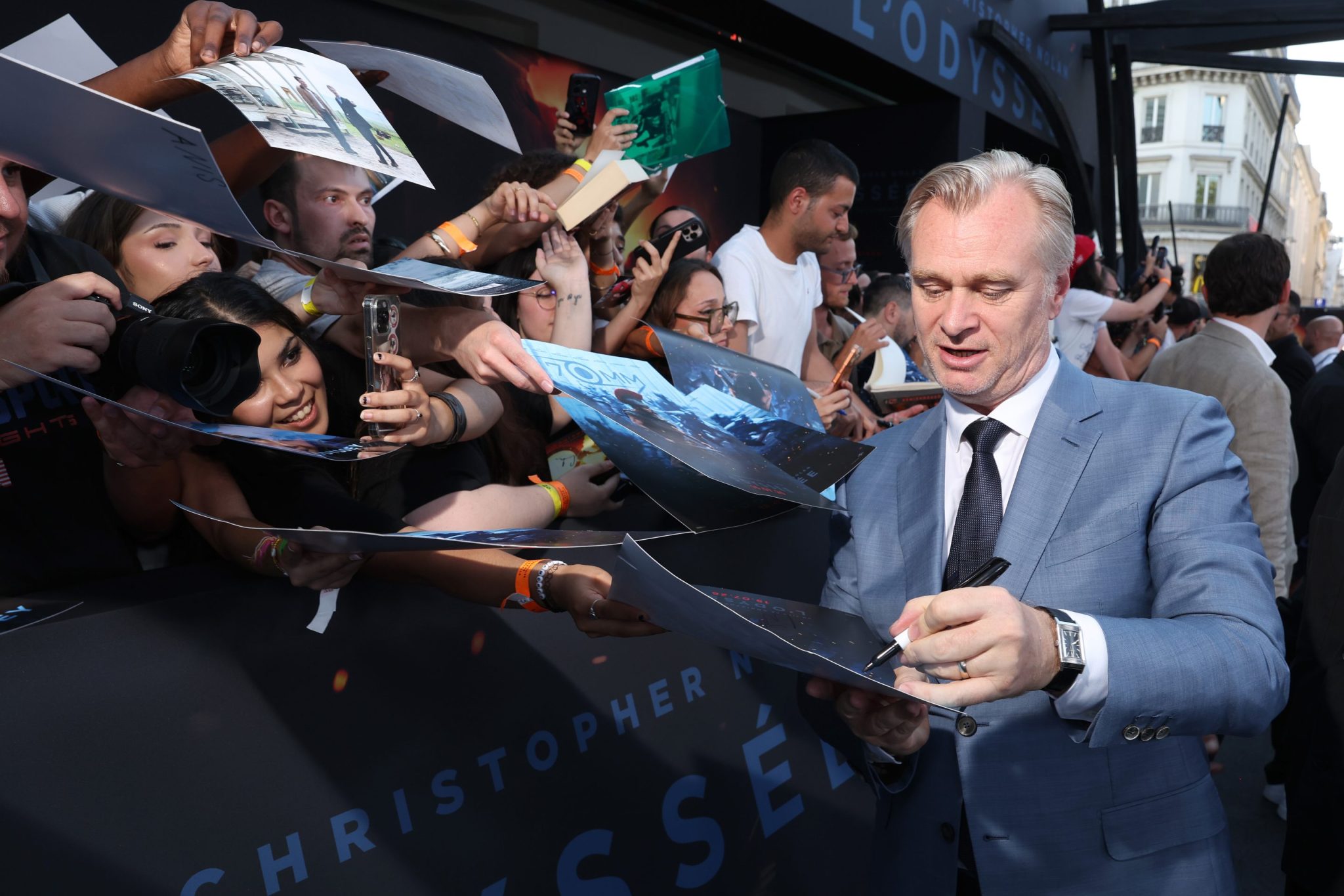Christopher Nolan interacts with fans at Odyssey premier