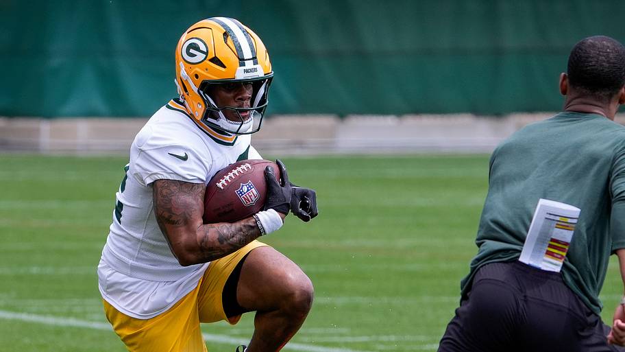 Green Bay Packers running back MarShawn Lloyd (32) runs through a drill during OTAs.