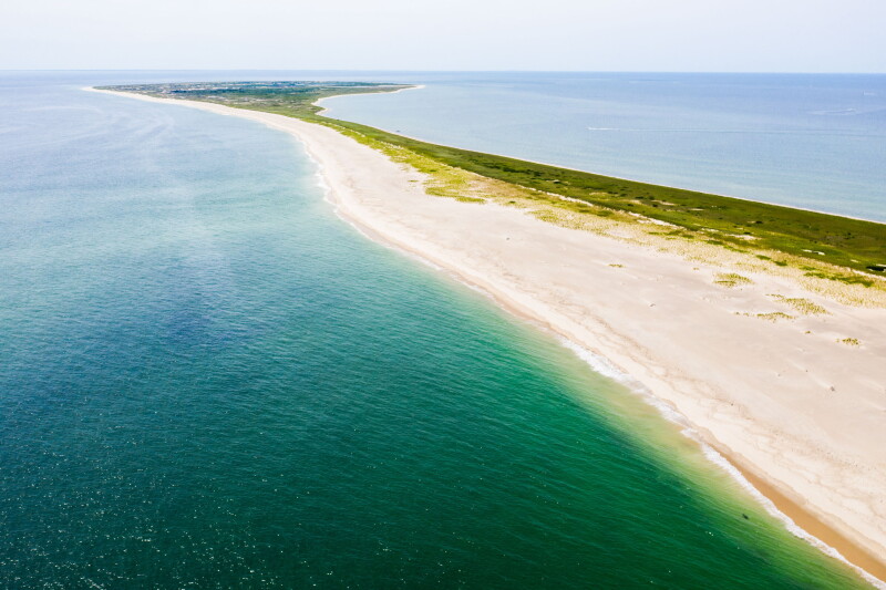 The cold waters of the Atlantic Ocean surround Monomoy Island on Cape Cod, Massachusetts. This beautiful area of New England, not too far from Boston, is a popular summer vacation destination.