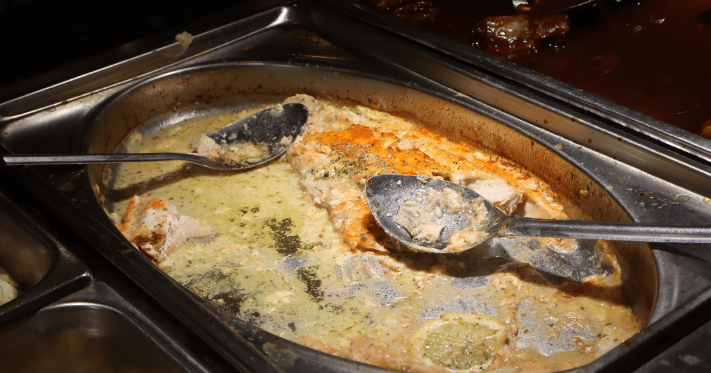 Baked salmon fillet in lemon herb sauce at Golden Palace Buffet in Livonia, MI.