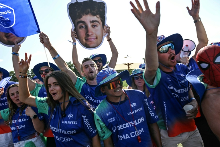 Fans of Paul Seixas cheered on the French teenage hope as he closed in on the young rider's white jersey