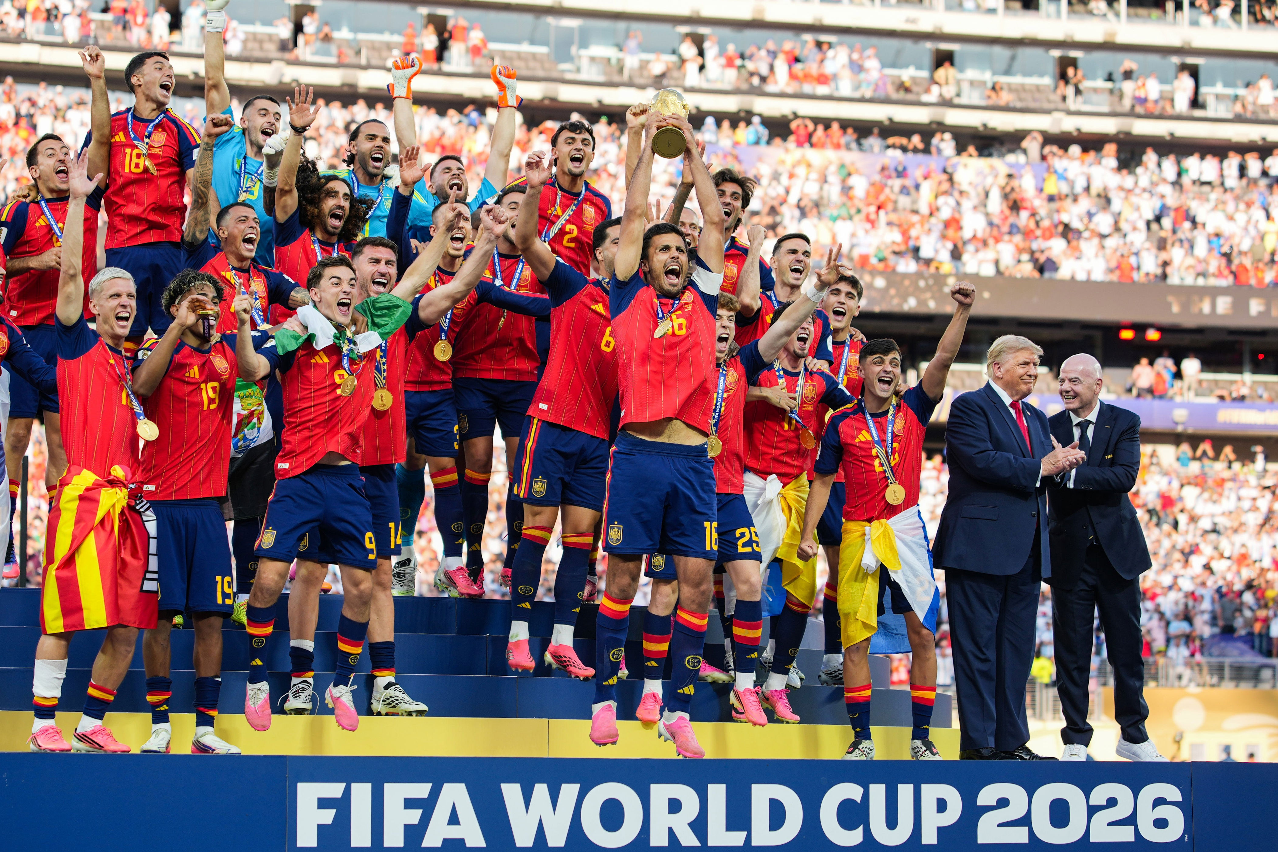 Soccer team celebrates winning FIFA World Cup 2026, holding the trophy on a podium, surrounded by cheering fans and officials