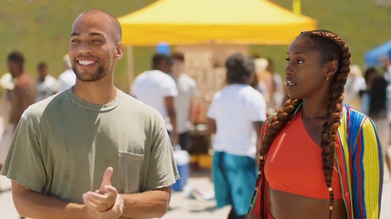 Issa Rae as Issa Dee and Kendrick Sampson as Nathan Campbell, standing next to each other at the beach in a scene from "Insecure."