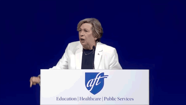 AFT union boss Randi Weingarten gesticulates at a conference.