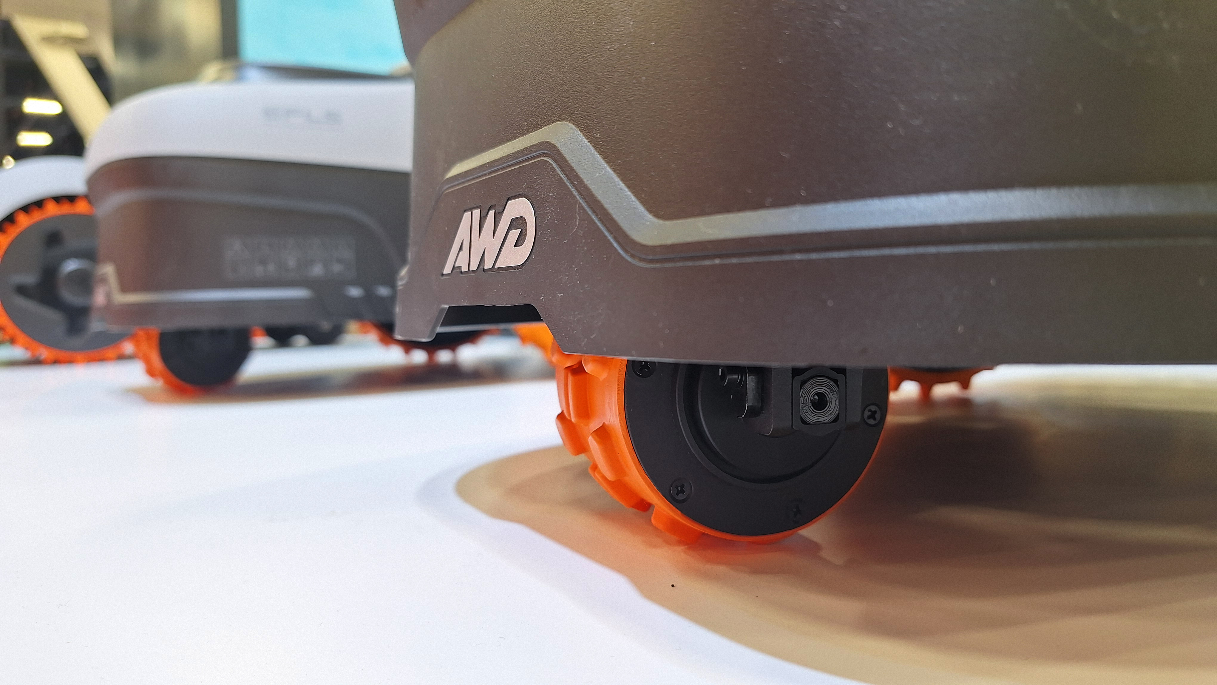 Navimow i2 AWD robot mower in action on astroturf