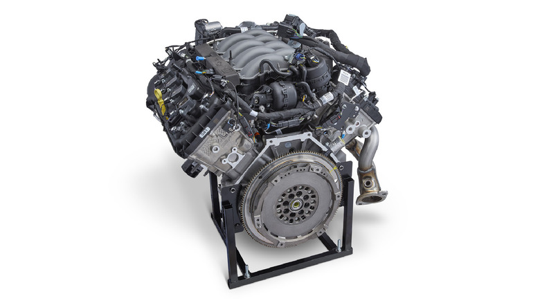 The rear view of a third-generation Ford Coyote crate engine, showing the transmission unit prominently.