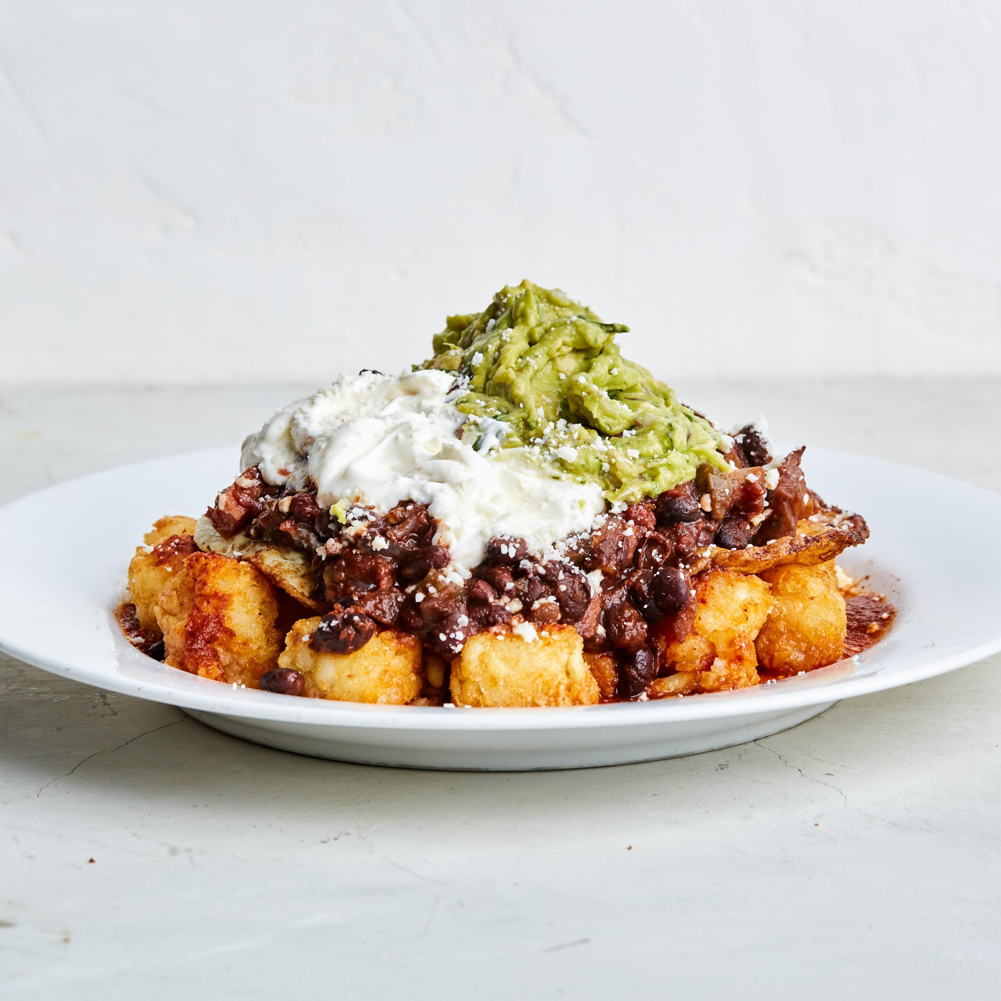 A plate of tater tops with meat, cheese, and quac from Dolores Park Cafe in San Francisco.