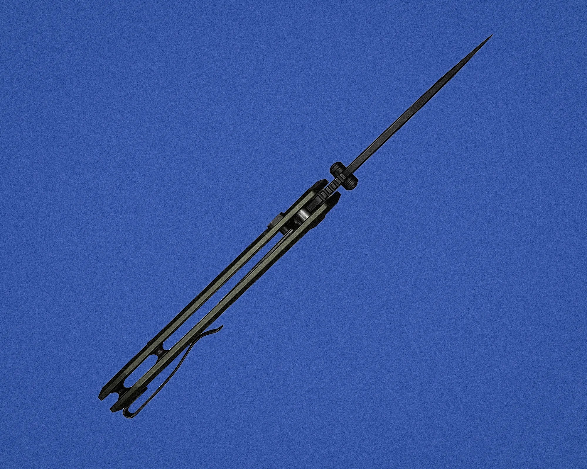 Black metal spear tip with a long shaft against a clear blue sky.
