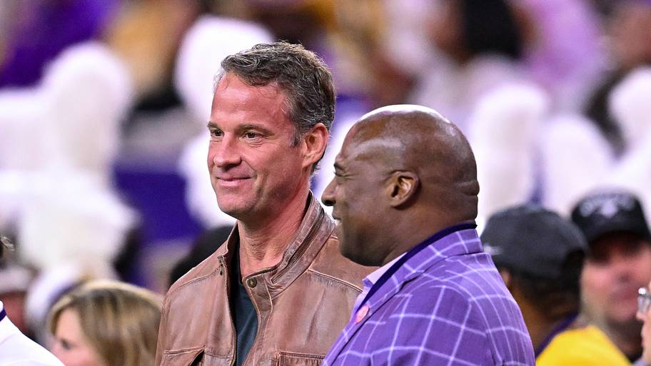 LSU Tigers head coach Lane Kiffin, left, stands next to athletic director Verge Ausberry.