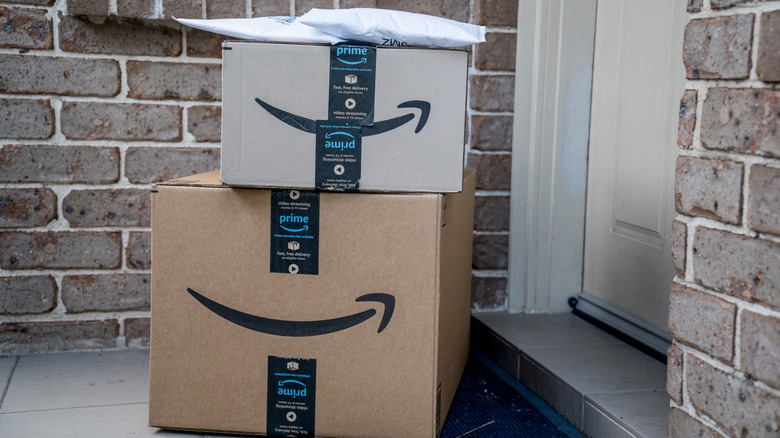 Amazon Prime boxes and a package at a house's front door
