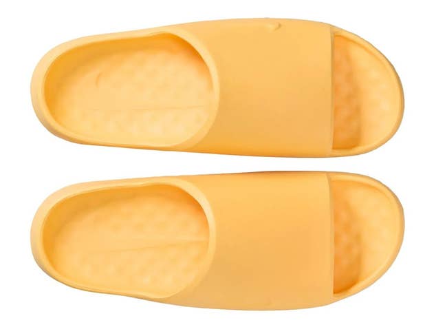 Comfortable open-toe slip-on sandals with a cushioned footbed, ideal for casual wear or lounging