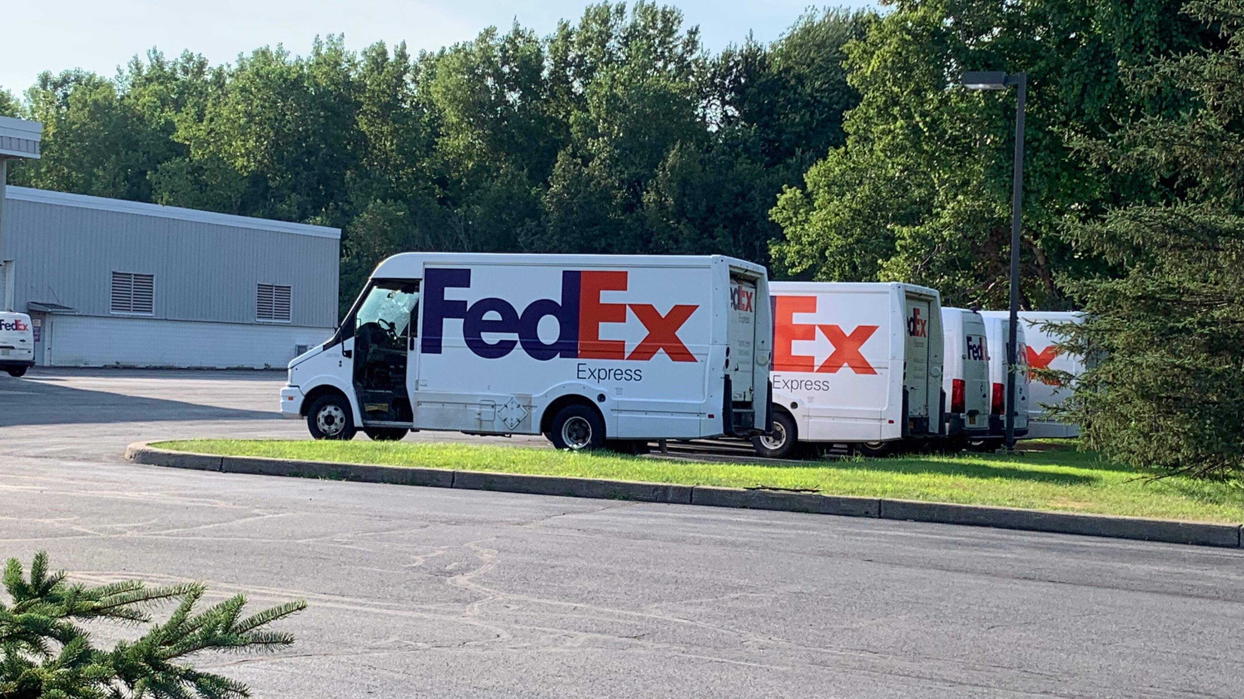 FedEx trucks are parked at the delivery company's shipping center at 6313 Running Ridge Road in Cicero on Monday, July 20, 2026. FedEx is laying off 164 workers at six facilities across Upstate New York, including 22 at the Cicero center.