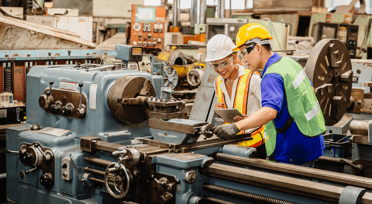 Engineers working on machine ©Adobe Stock Images