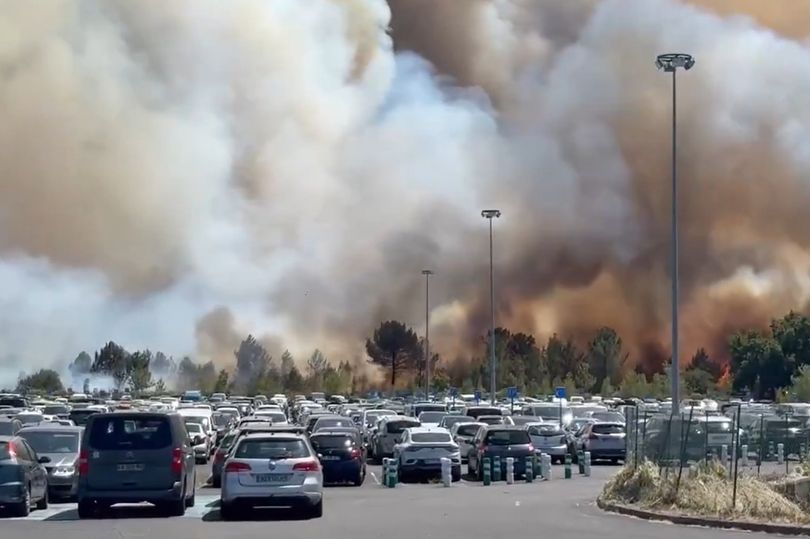 The fire spread near an airport and has caused delays