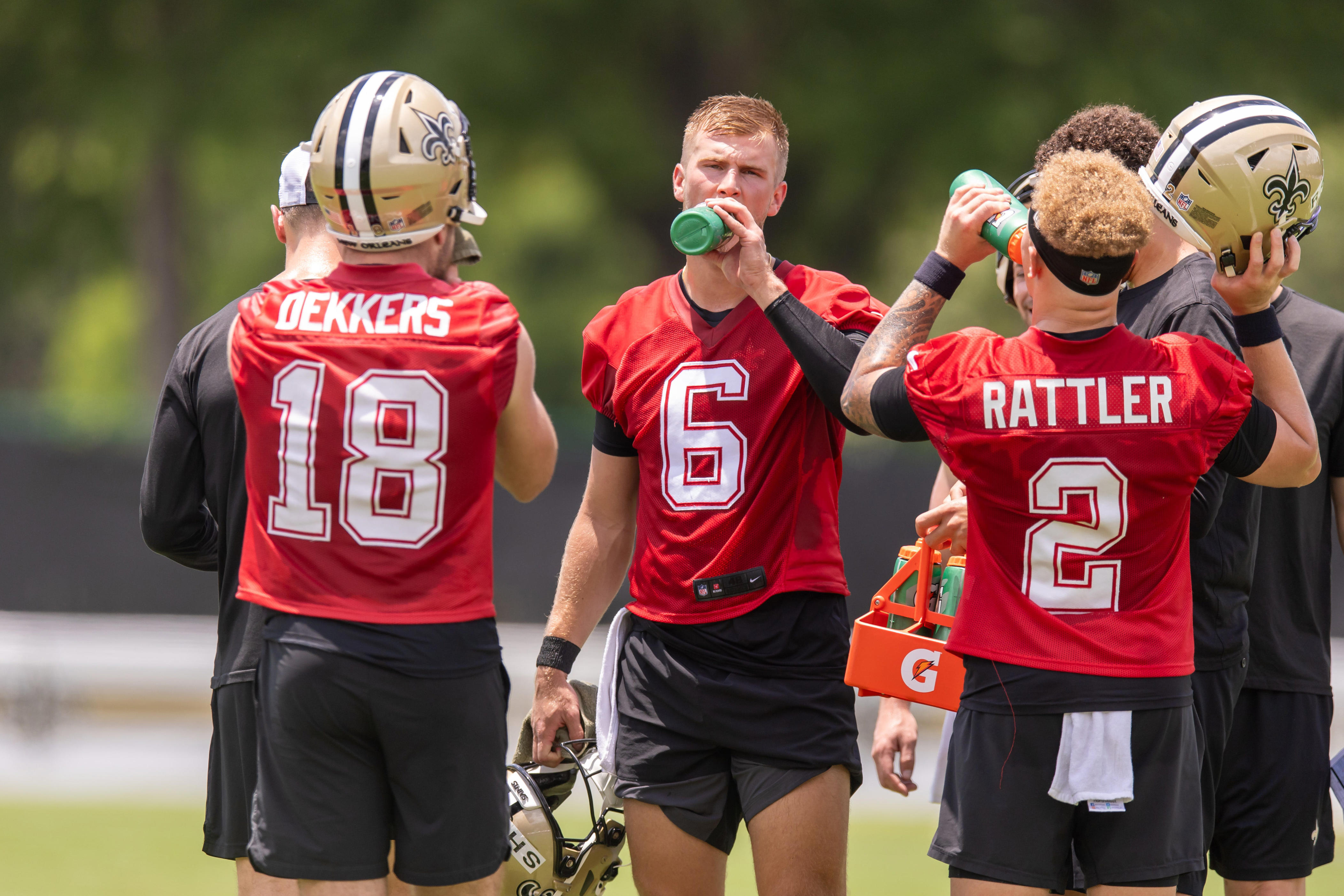 Jun 10, 2025; New Orleans, LA, USA; New Orleans Saints quarterback Tyler Shough (6) and quarterback Spencer Rattler (2) and quarterback Hunter Dekkers (18) take a water break during minicamp at Ochsner Sports Performance Center. Mandatory Credit: Stephen Lew-Imagn Images