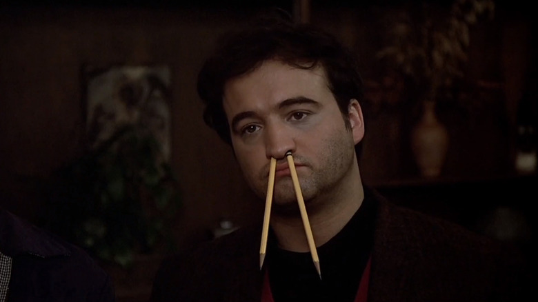 John Belushi as Bluto with pencils in his nose in National Lampoon's Animal House