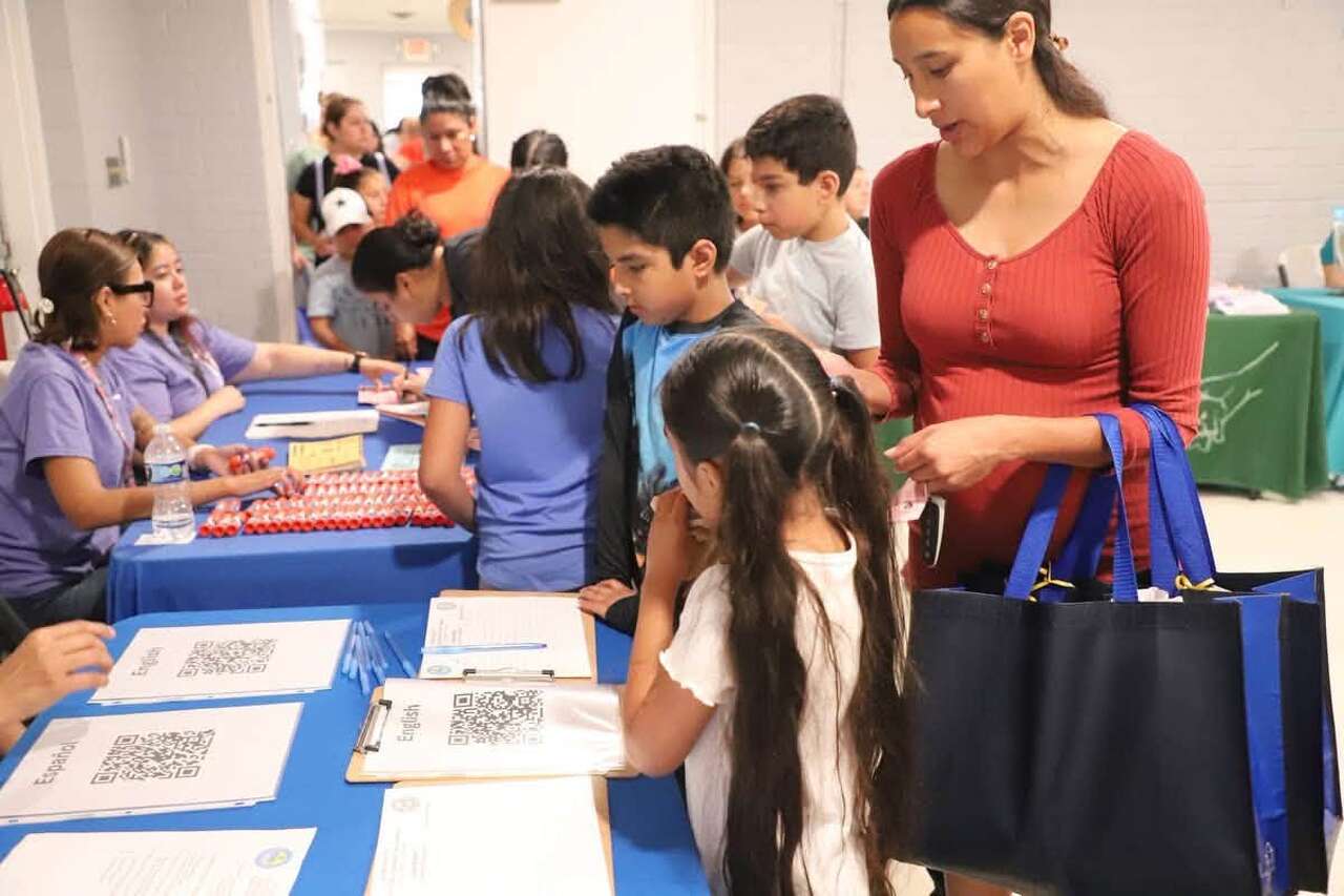 Precinct 2 students receive backpacks and school supplies