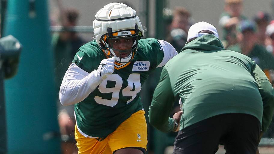 Green Bay Packers defensive lineman Karl Brooks (94) runs through a drill during the first day of training camp in 2024.