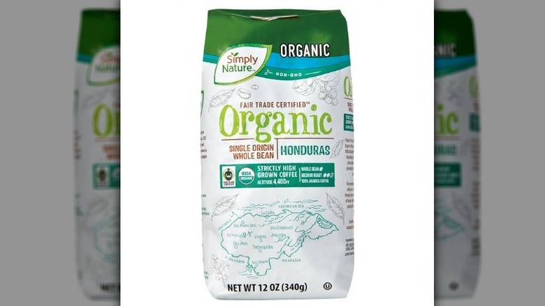 Organic single origin Honduran coffee in a white and green bag on a white background.