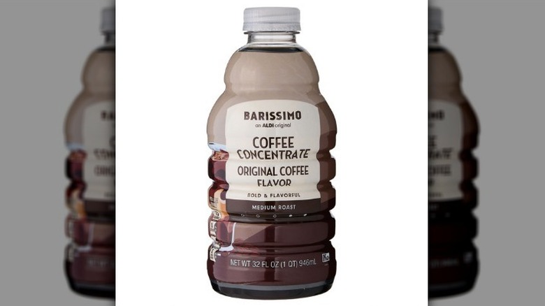 Coffee concentrate in a brown plastic bottle on a white background.