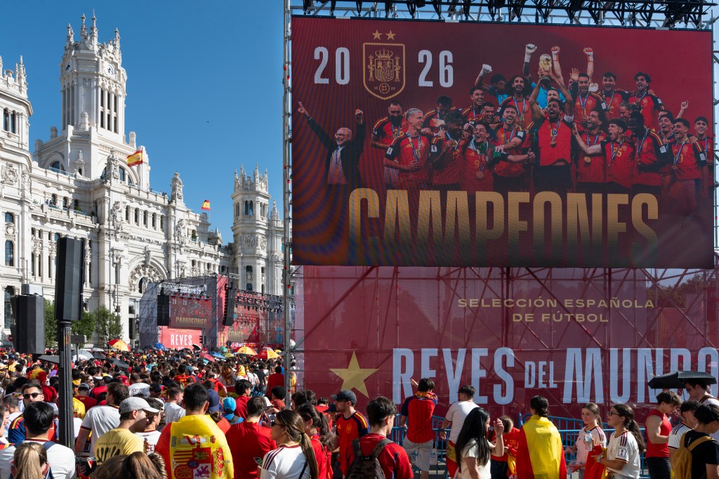 MADRID, SPAIN - 2026/07/20: Spanish football fans gather in front of a giant stage screen reading