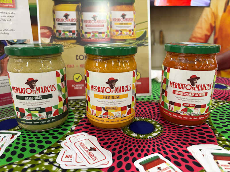 Three jars of simmer sauces labeled
