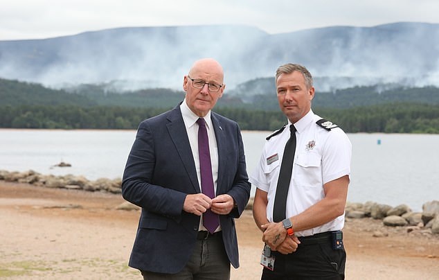 First Minister John Swinney and Deputy Assistant Fire Chief Kenny Barbour in the Cairngorms