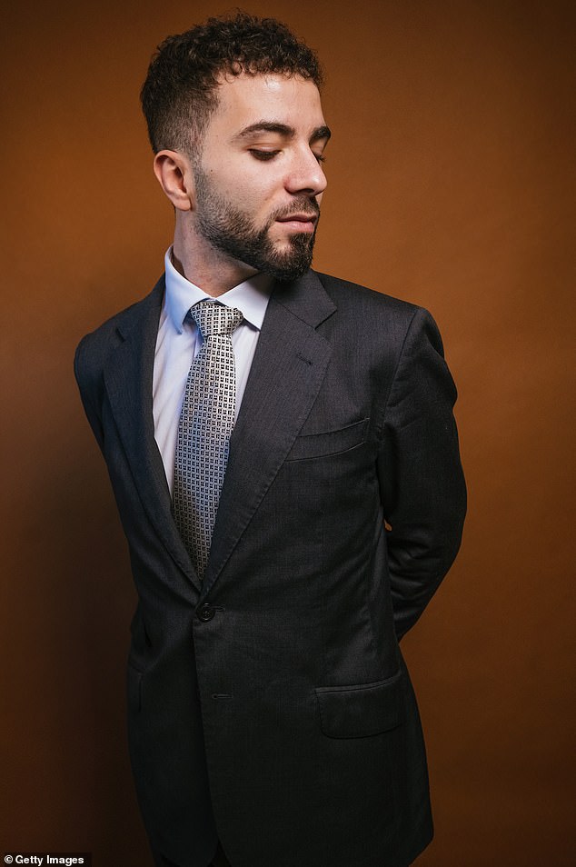 The man said the expensive procedure 'was worth every cent,' as it gave him confidence and improved colleagues' perception of him. A stock image of a bearded professional is pictured