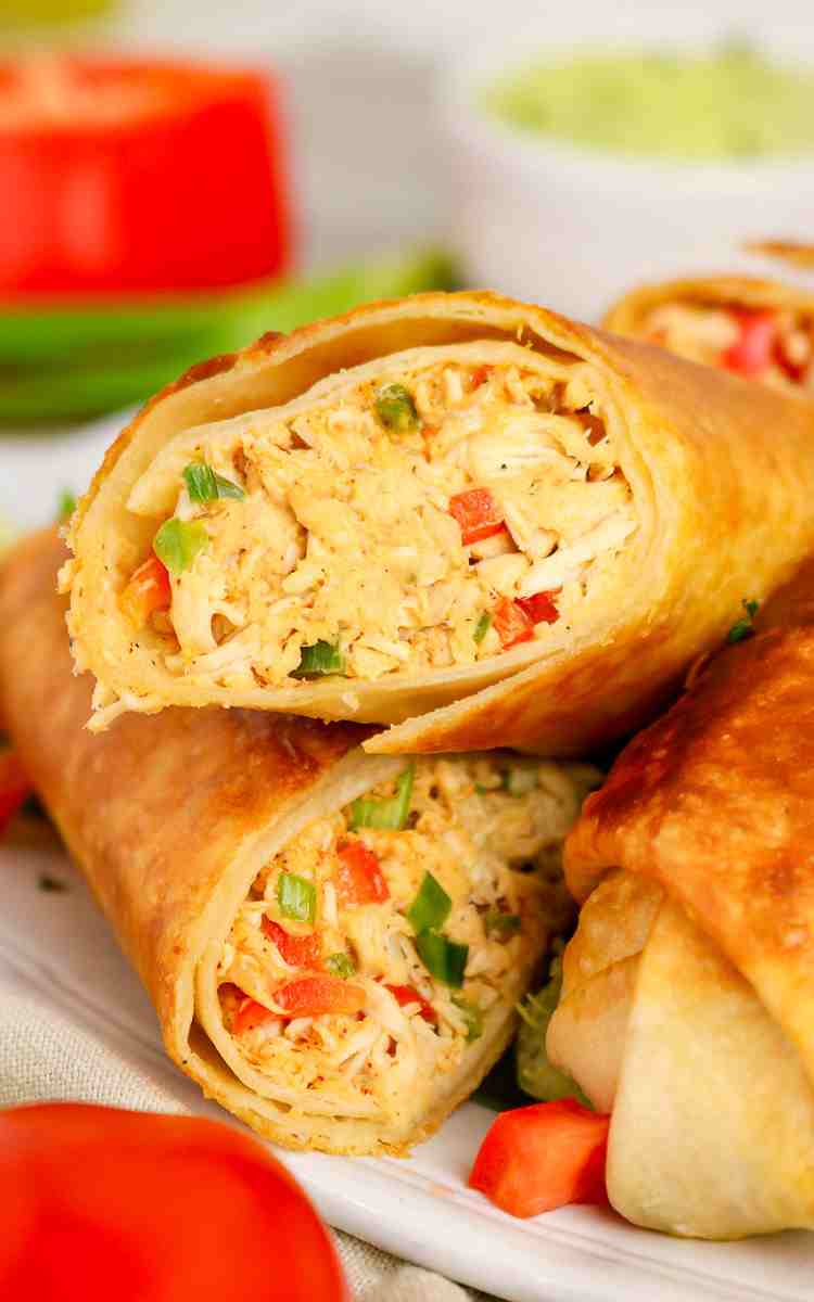 Diced peppers and shredded chicken inside of a firecracker wrap.