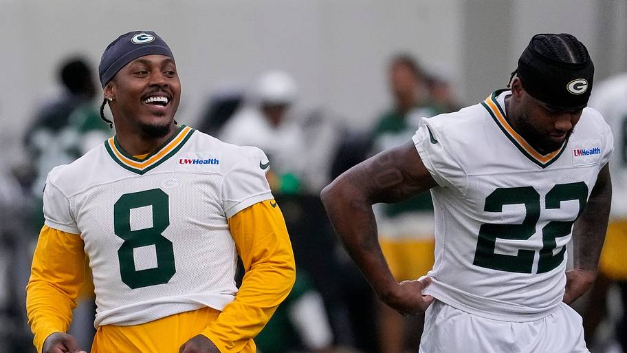 Green Bay Packers running back Josh Jacobs (8) laughs alongside Pierre Strong during OTAs.