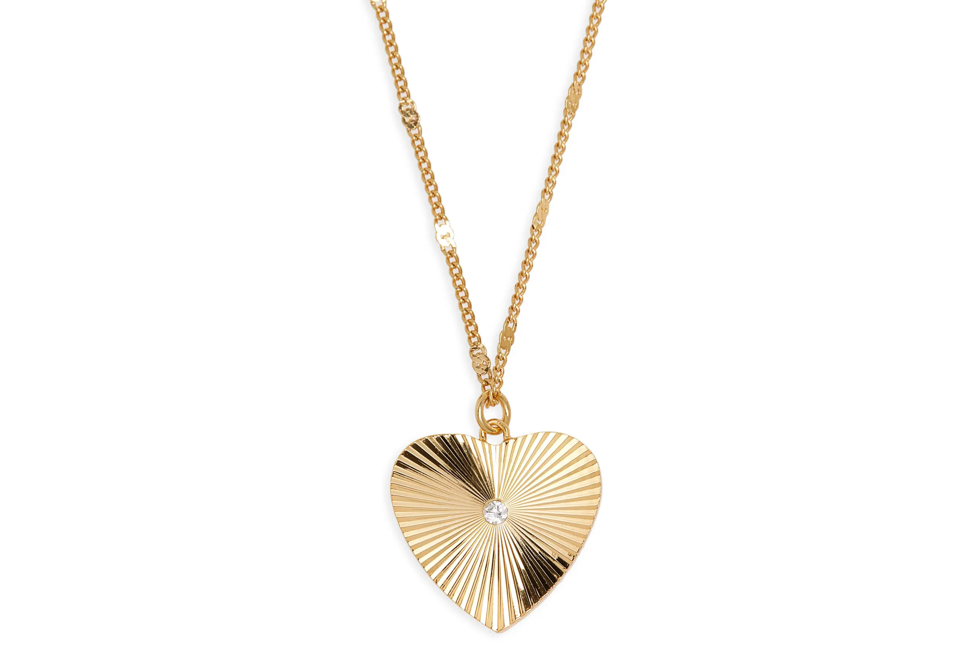 A gold heart-shaped pendant with a faceted diamond in the center, hanging from a gold chain.