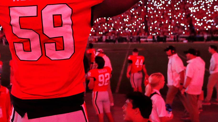 Georgia offensive lineman Bo Hughley (59) celebrates as Sanford Stadium is turned red as the game goes into the fourth during