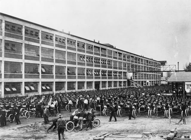 Model T Fords, lined row on row, form a pattern of progress outside Henry Ford's plant, Highland Park, Michigan, October 1913