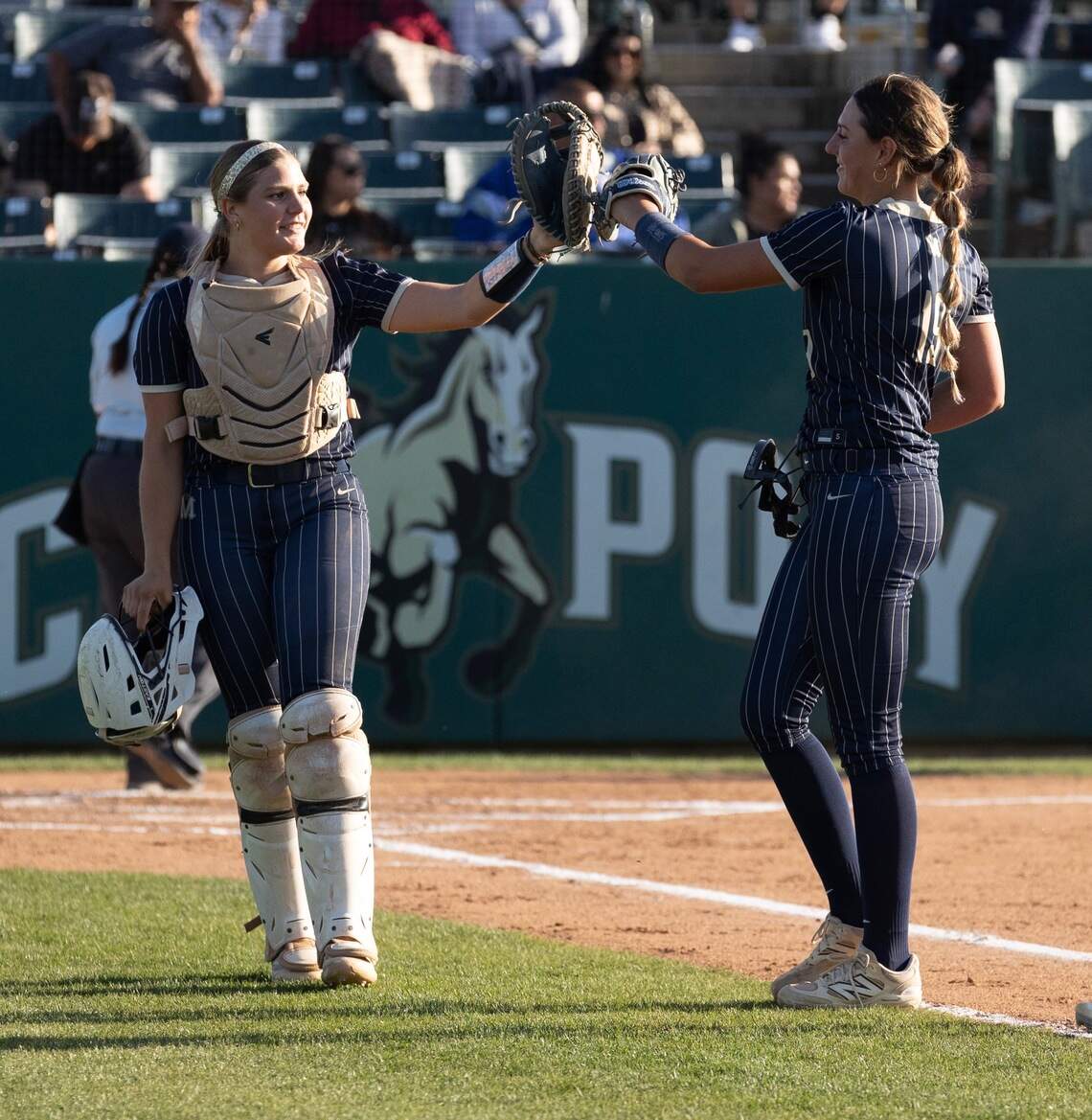 Violet D’Orazio-Lelli (left) and Landrie Hinrichs (right) at a Mission Prep softball game held at Cal Poly in the spring.