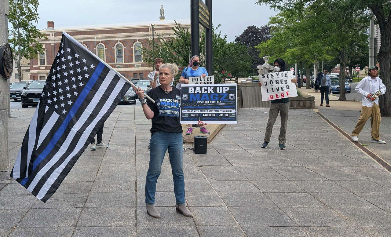 Protesters follow ex-Hartford cop after hearing on manslaughter charge in fatal shooting