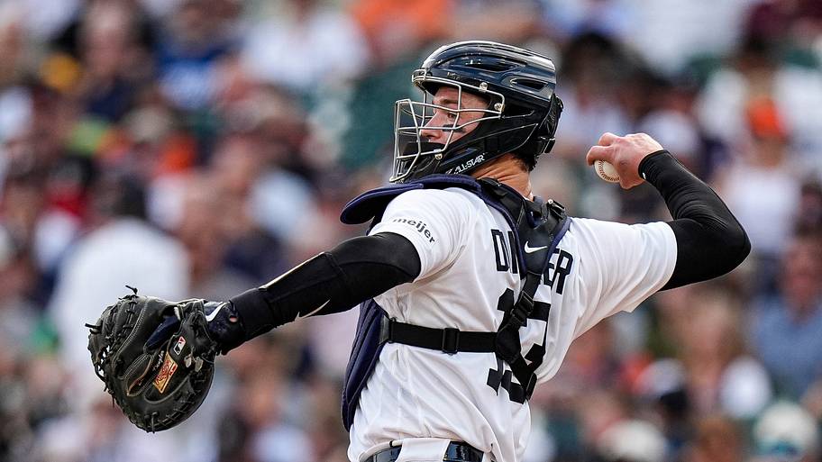 Detroit Tigers catcher Dillon Dingler practices a throw.