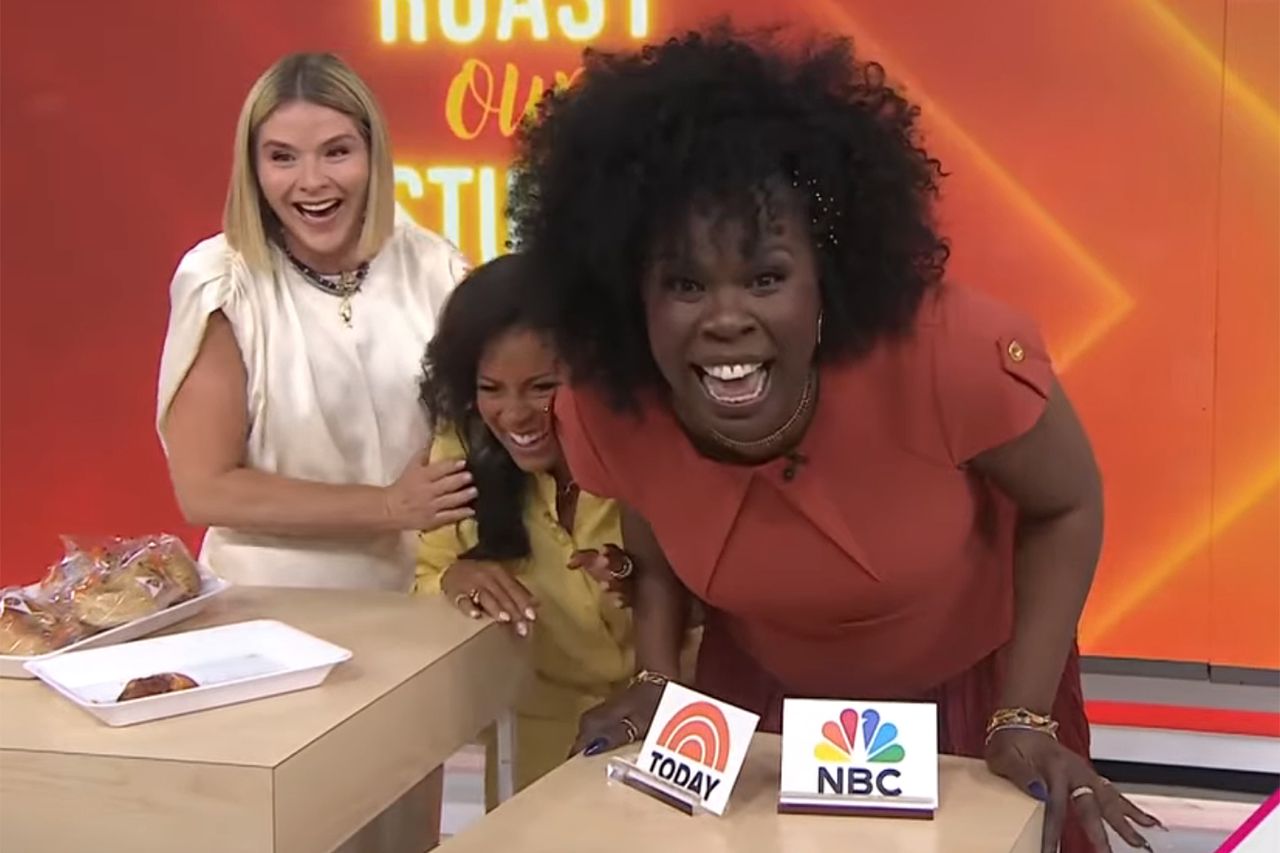Leslie Jones and Jenna Bush Hager interacting enthusiastically on a talk show set