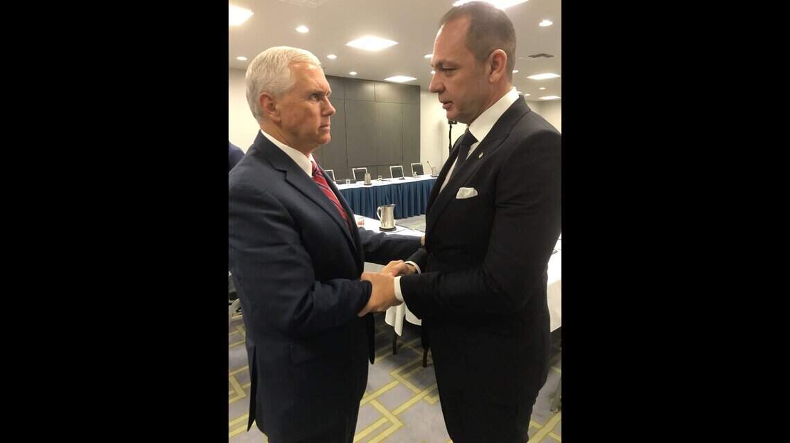 Then-Vice President Mike Pence, left, shakes hands with Raúl Gorrín in Miami on June 15, 2017.