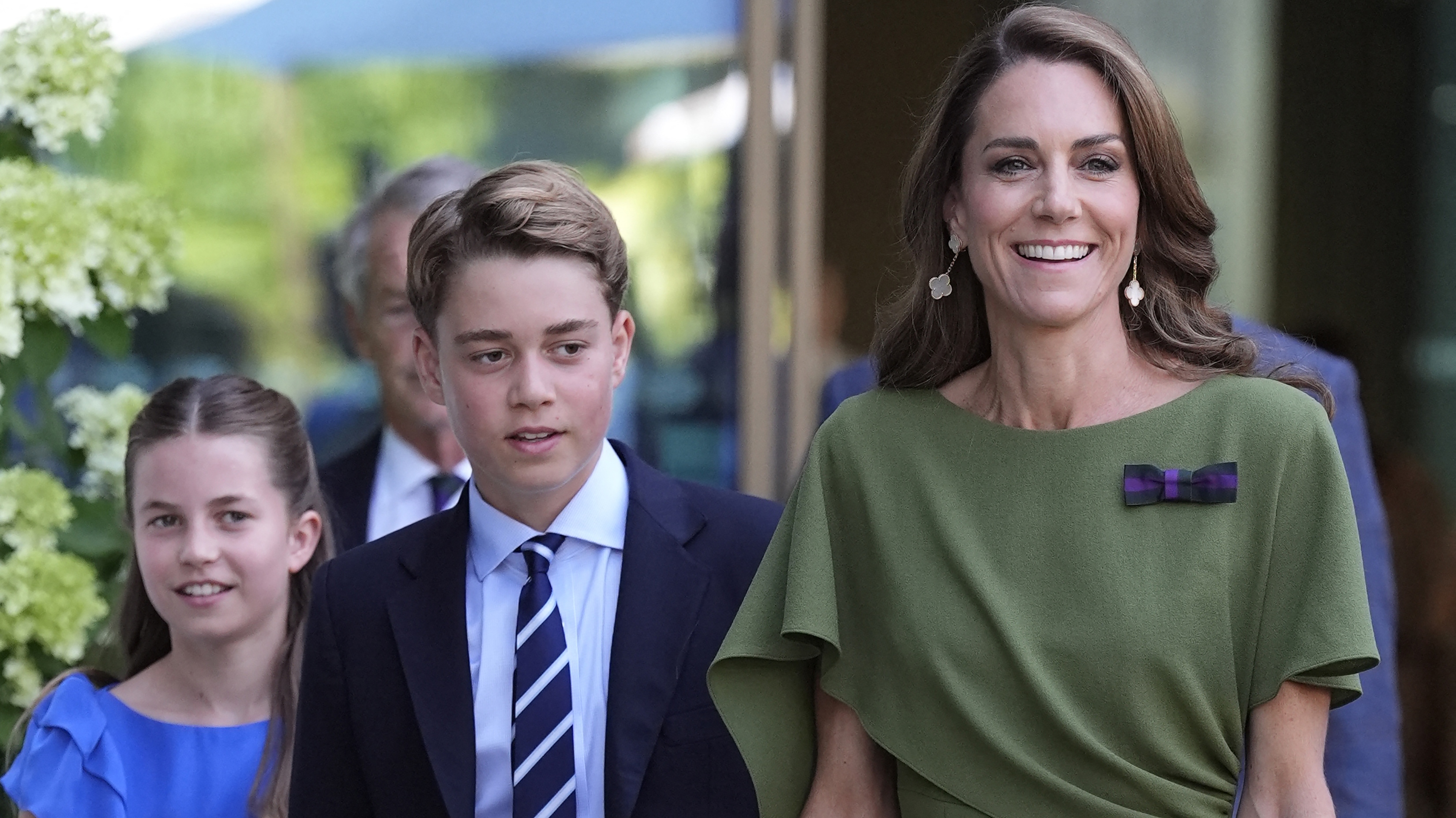 Catherine, Princess of Wales (R), Prince George of Wales (C) and Princess Charlotte of Wales arrive to attend the men's singles final at Wimbledon 2026