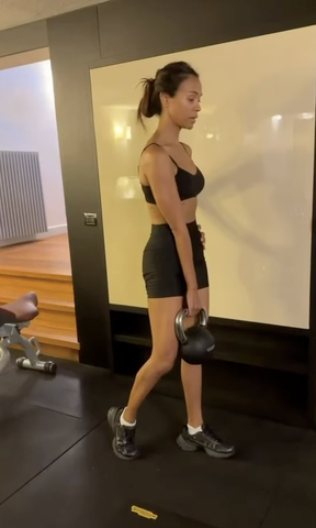 Zoe Saldana in a gym working out