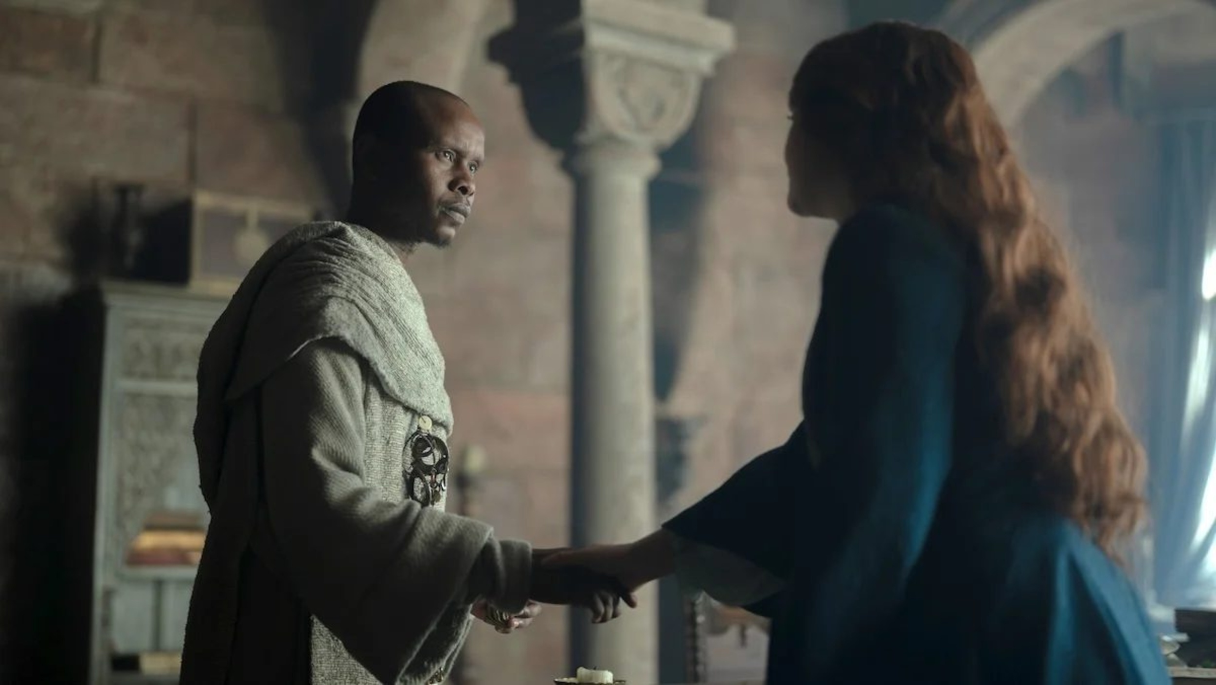 Grand Maester Orwyle shakes hands with Alicent on House of the Dragon