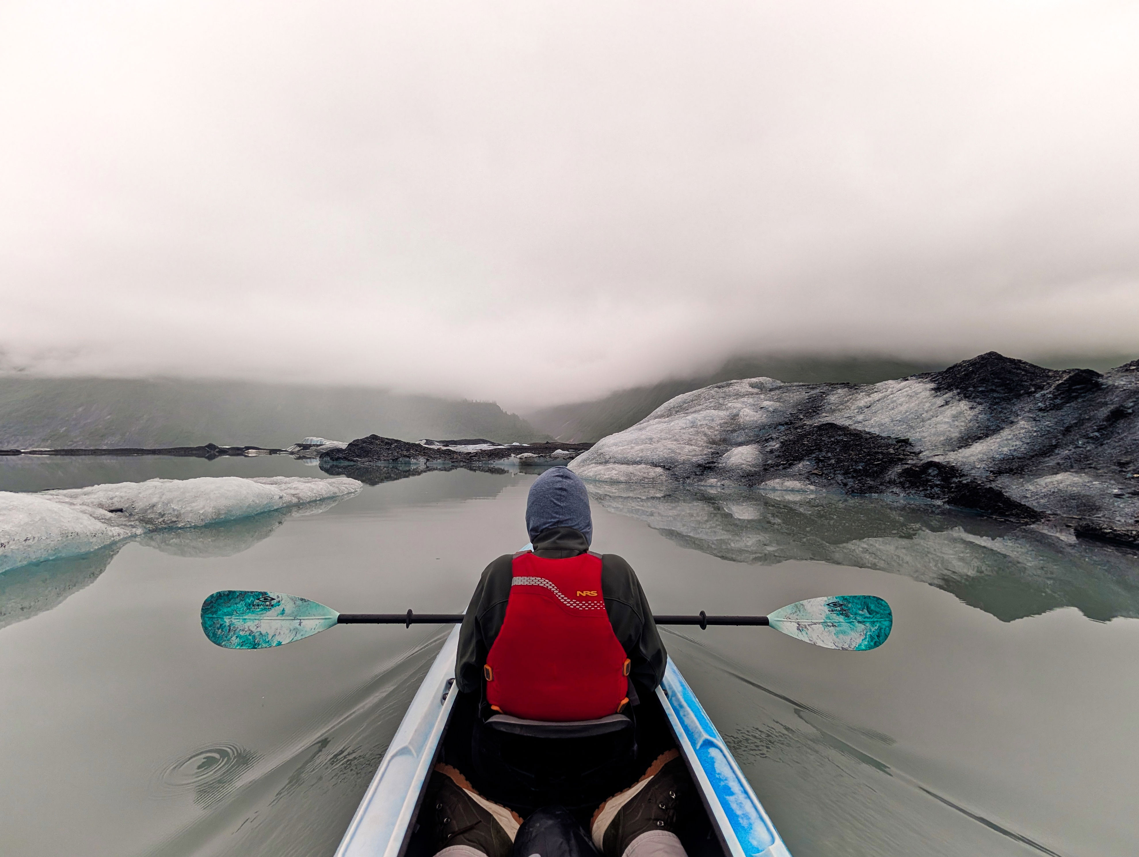 Kayaking on Valdez Glacial Lake at the face of the Valdez Glacier, Alaska