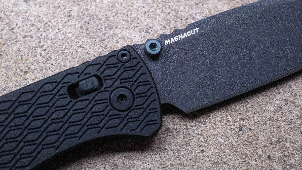 Black folding knife with textured handle and