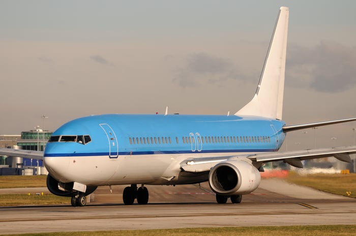 An airplane sits on the tarmac.