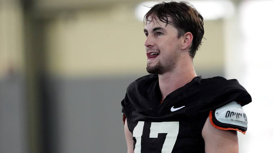 Oklahoma State's Drew Mestemaker takes a break during a workout in his jersey.
