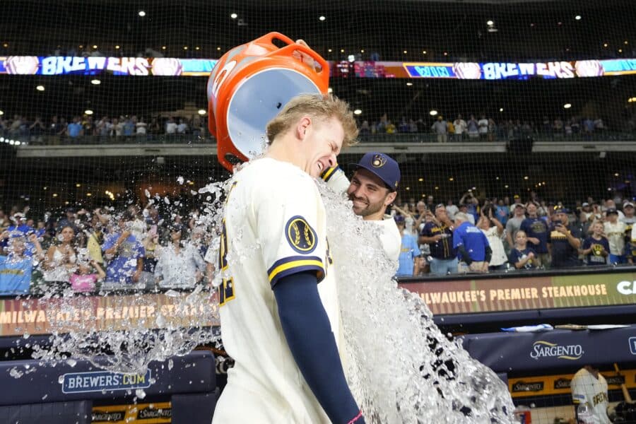 Jul 20, 2026; Milwaukee, Wisconsin, USA; Milwaukee Brewers shortstop Cooper Pratt (12) gets dunked by center fielder Garrett Mitchell (5) following the game against the New York Mets at American Family Field. Mandatory Credit: Jeff Hanisch-Imagn Images