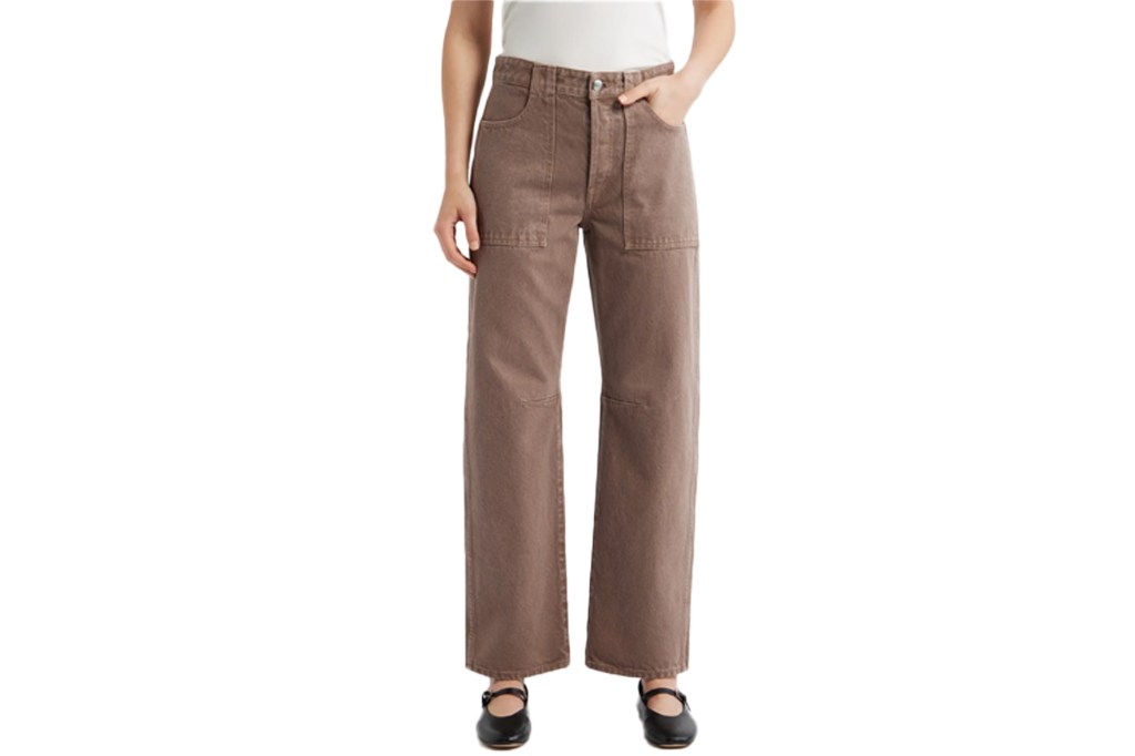 A person models brown wide-leg pants with patch pockets.