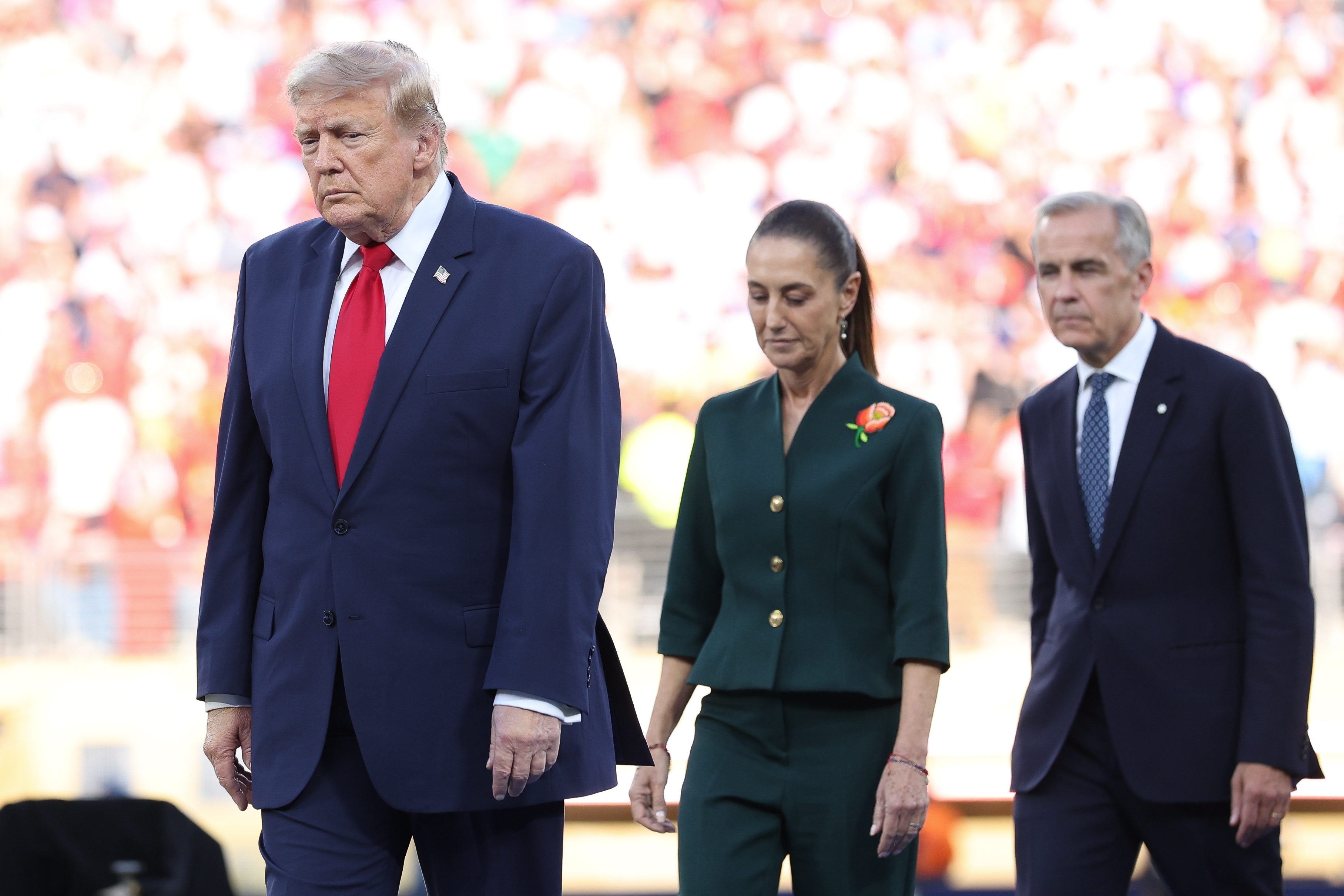 EAST RUTHERFORD, NEW JERSEY - JULY 19: Donald Trump, president of the United States of America, walks ahead of Claudia Sheinbaum, president of Mexico, and Mark Carney, prime minister of Canada, during the FIFA World Cup 2026 Final match between Spain and Argentina at New York New Jersey Stadium on July 19, 2026 in East Rutherford, New Jersey. (Photo by Alex Livesey - Danehouse/Getty Images)