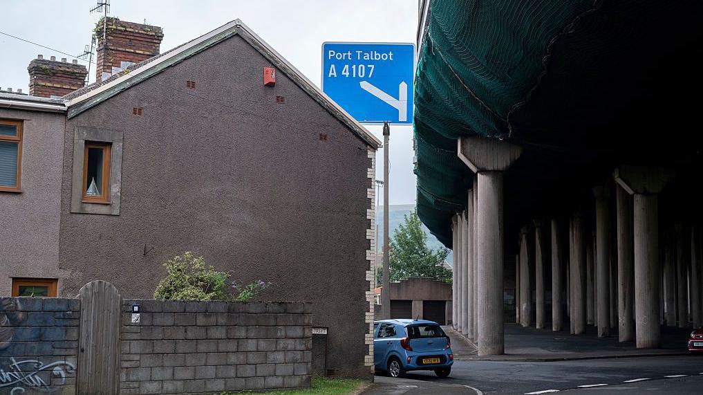 While some roads are cut in half by the M4 in Port Talbot, others weave around the pillars that hold up the road deck very close to people's homes
