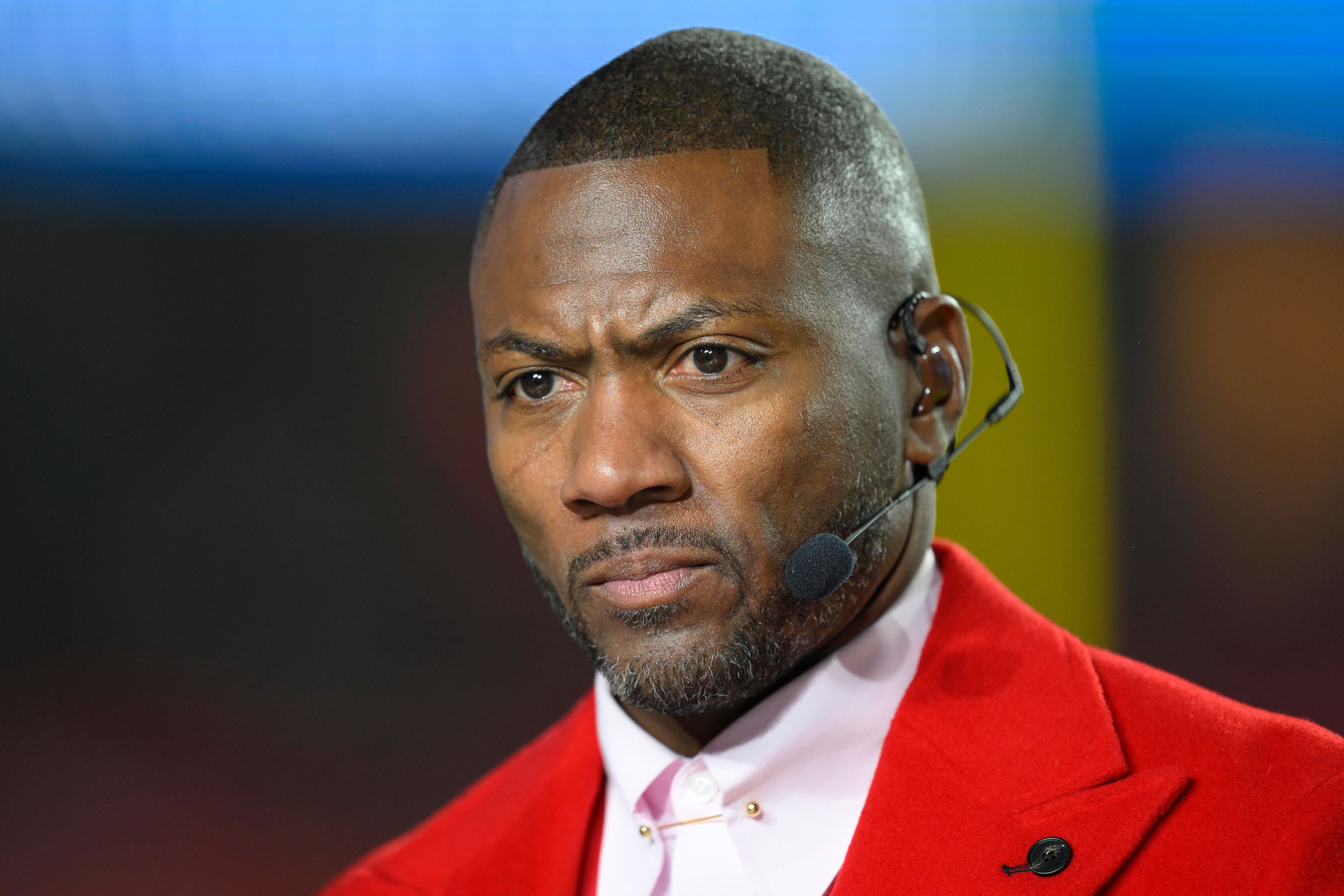 FILE - ESPN Monday Night Football Countdown commentator Ryan Clark looks to the cameras during warmups before an NFL football game between the Kansas City Chiefs and the Washington Commanders, Oct. 27, 2025 in Kansas City, Mo. (AP Photo/Reed Hoffmann, File)